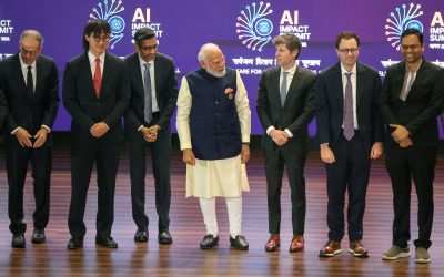 Tentativele insolite ale liderilor în tehnologie la un summit internațional de AI din India au declanșat într-un mod neașteptat o serie de speculații despre rivalitatea acerbă dintre cei mai influenți jucători din Silicon Valley